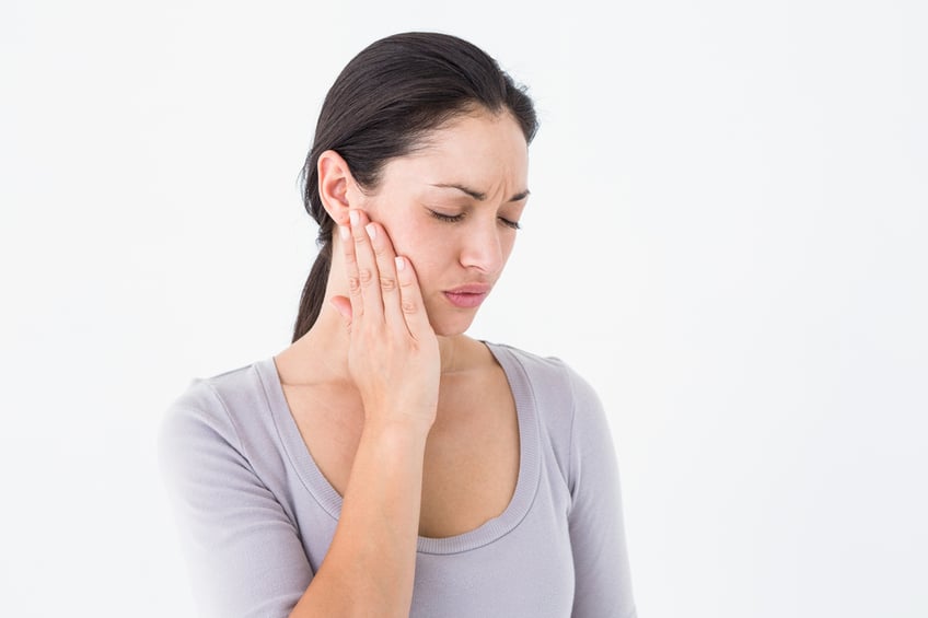 Woman suffering from teeth pain on white background-1