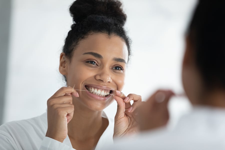 proper cleaning with flossing teeth